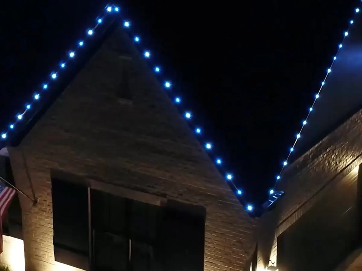 Evenly spaced lights along a gable roofline